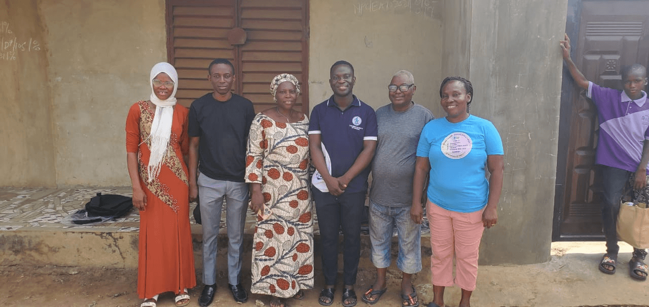 Six members of the outreach team standing together outside a building.